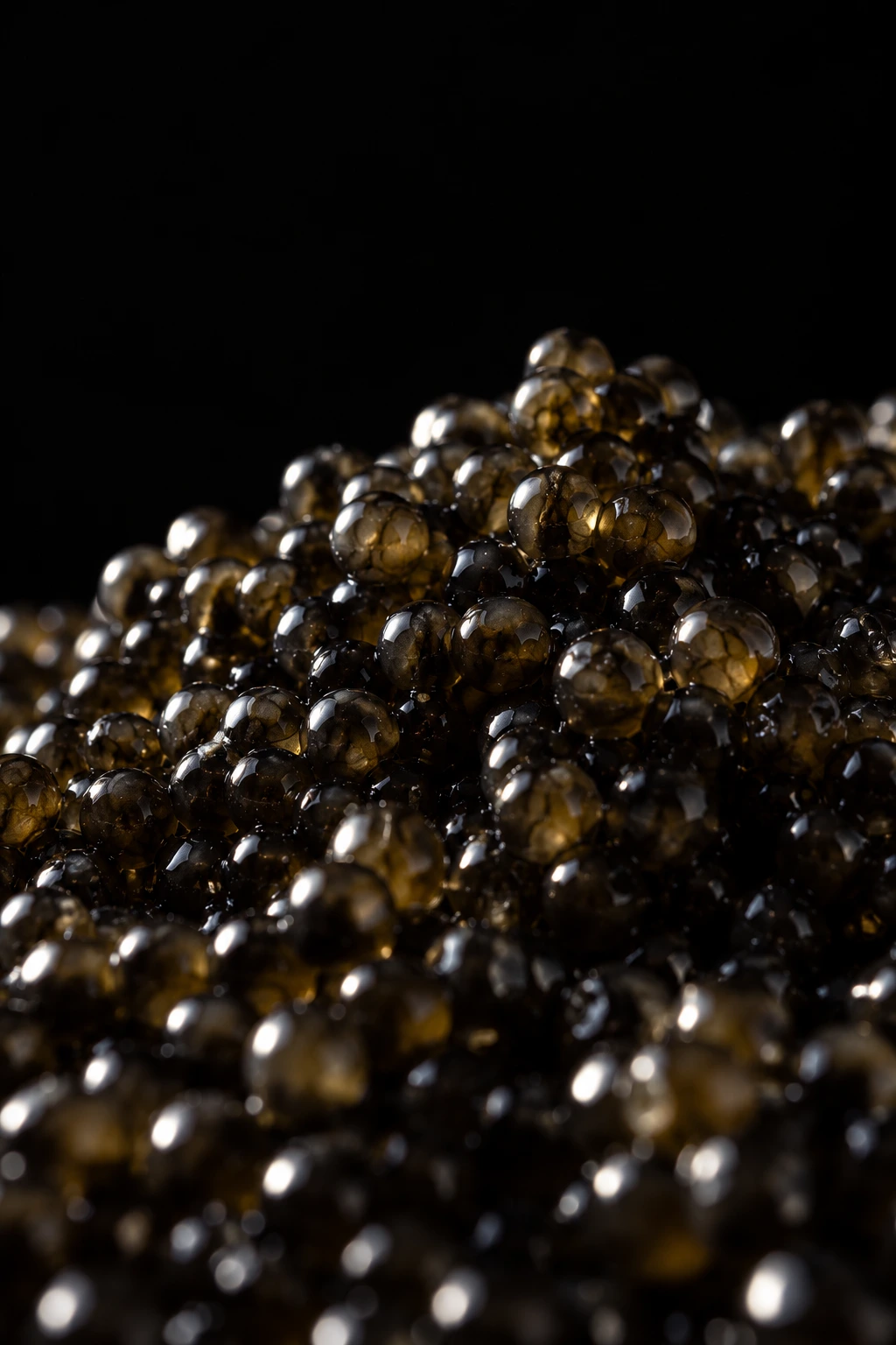The complete dark macro photograph of caviar pearls, with olive-green and bronze reflections against black